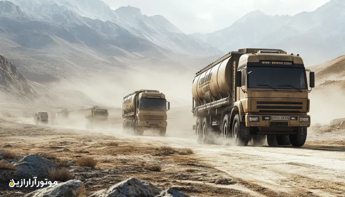 کاروانی از کامیونهای صادراتی سنگین در حال عبور از جادههای کوهستانی و بیابانی تحت شرایط آبوهوایی سخت